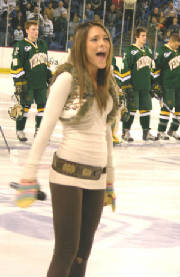 Photo of Julie Dubela singing the National Anthem at UNH hockey game