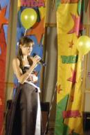 Photo of Julie Dubela singing at the MDA Talent Showcase