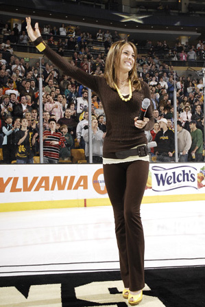 Photo of Julie Dubela singing the National Anthem at a Boston Bruins hockey game