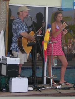 Photo of Julie Dubela singing with Dave Weber on guitar at “The Shell” on Long Beach Island, New Jersey